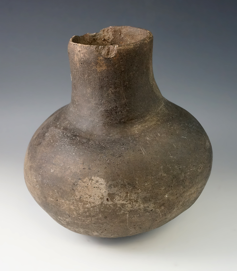 7 3/4" Tall Shell Tempered Clay Waterbottle found in Arkansas.