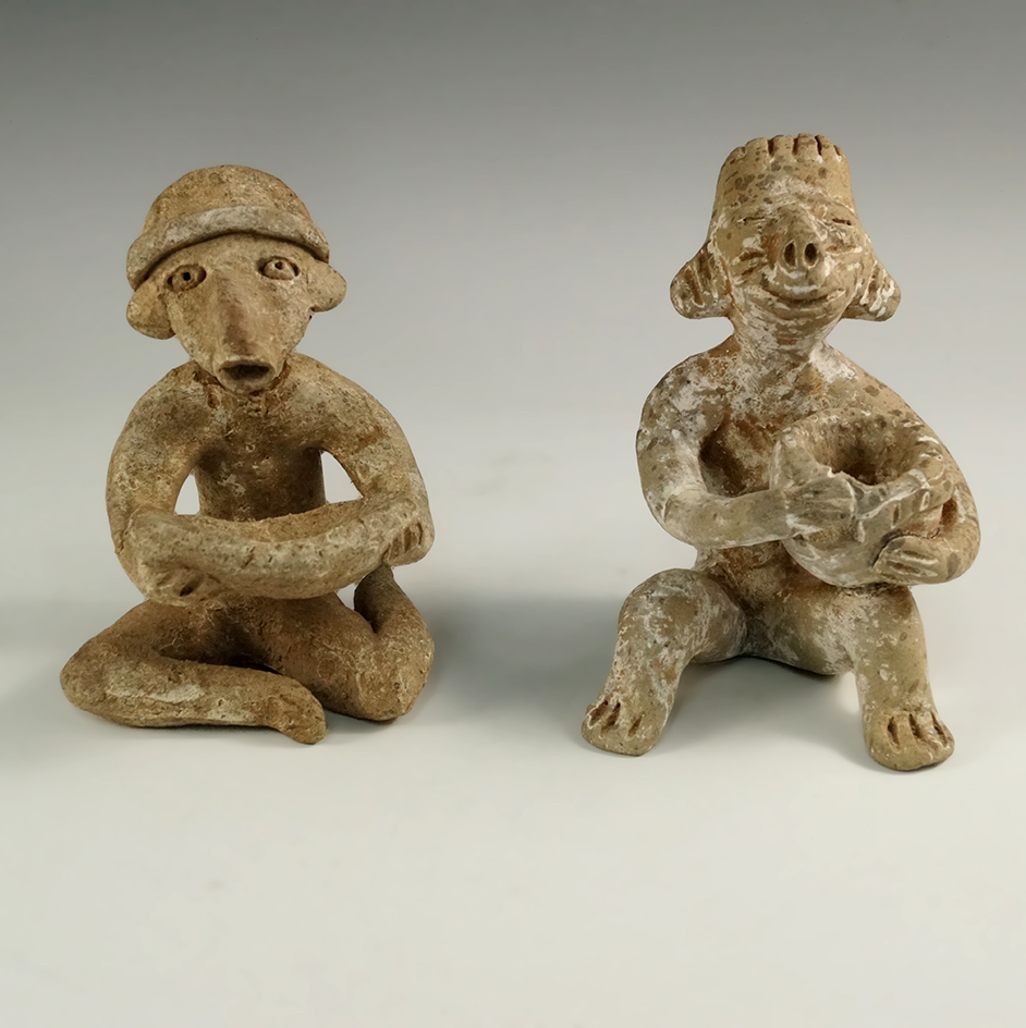 Pair of Nayarit figures, approximately 4 3/8" tall made from clay, recovered in Mexico.