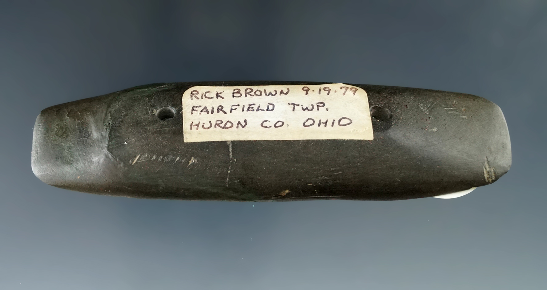 Nicely scooped 4" Slate Boatstone with restoration to one end. Fairfield Township, Huron Co. Ohio.