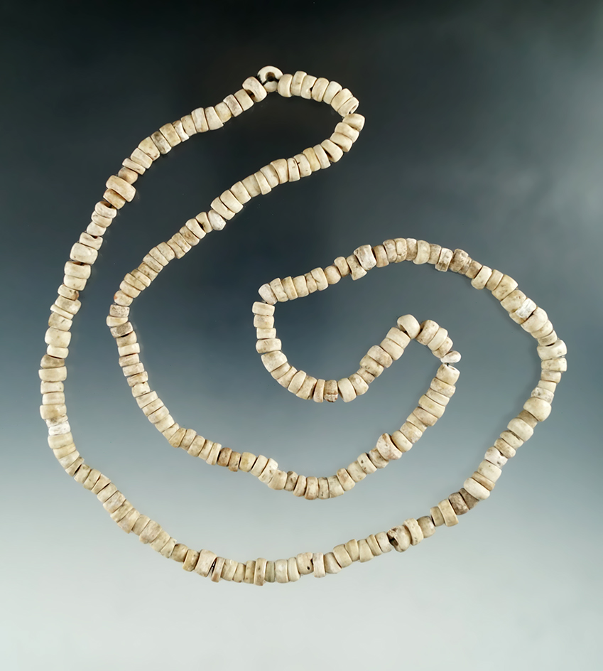 28" long strand of nicely patinated drilled shell beads from a site in Illinois.