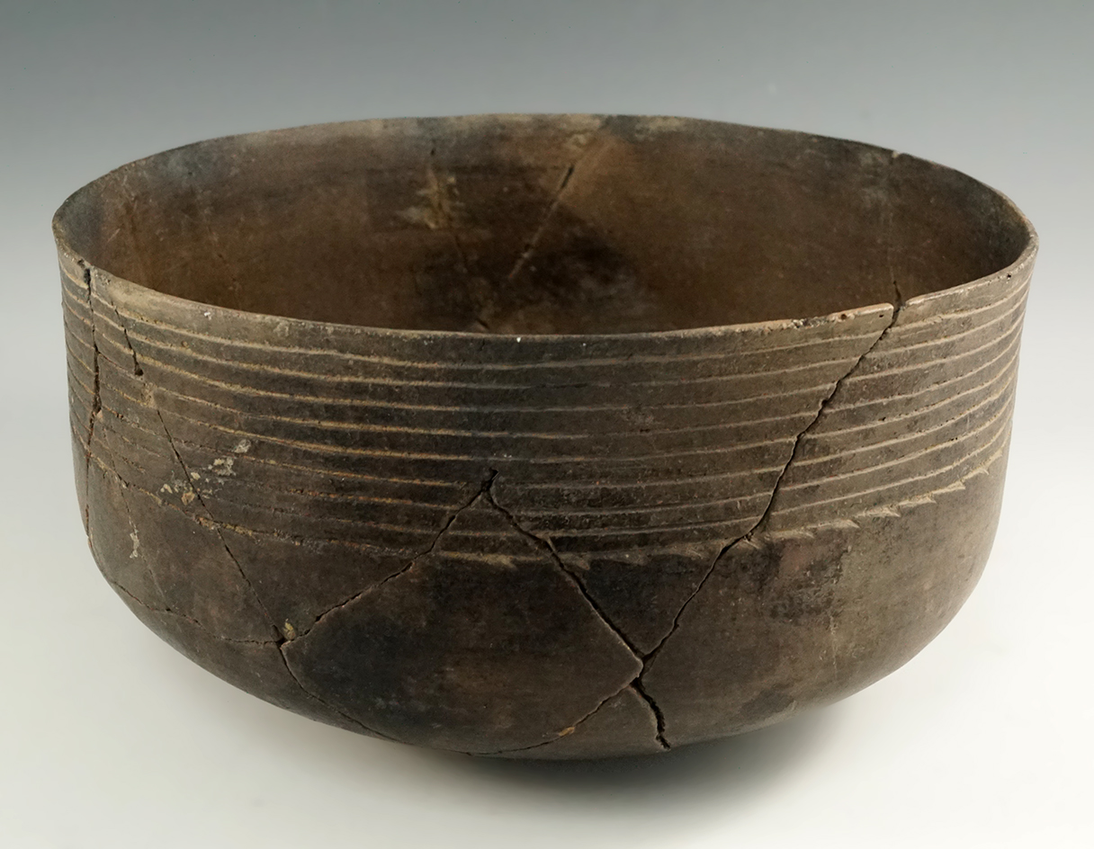 9 1/2" wide by 4" tall Caddo pottery vessel found in Arkansas- glued back together but not restored.