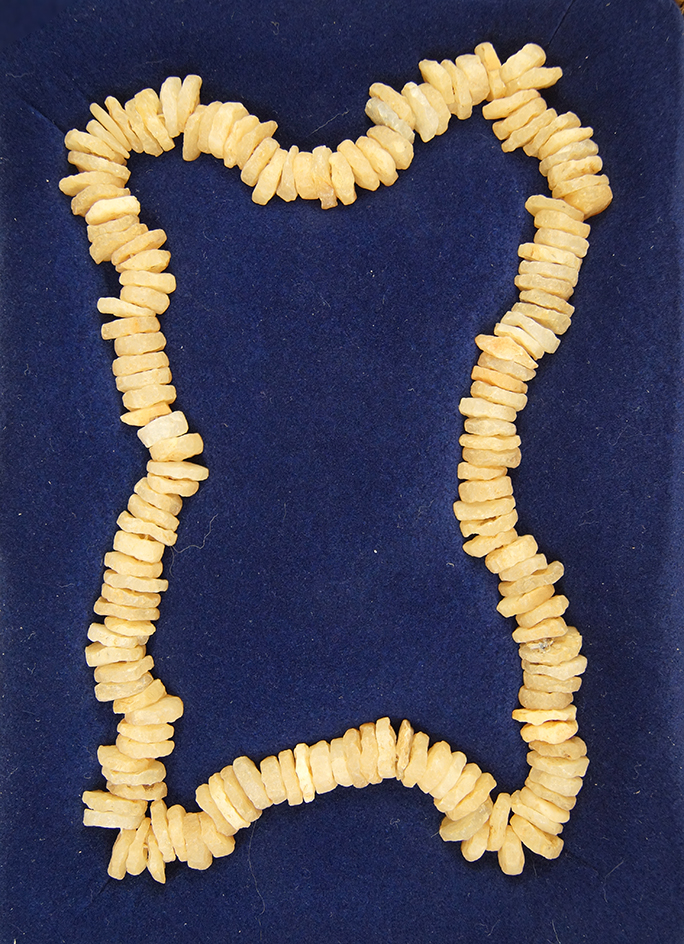 Nice framed display of Neolithic. Drilled quartz beads.