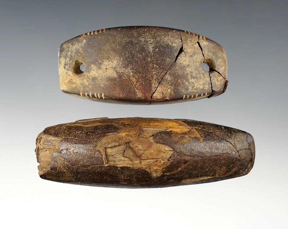Pair of Humped Gorgets. One is undrilled and the other has multiple tallies. Both glued.