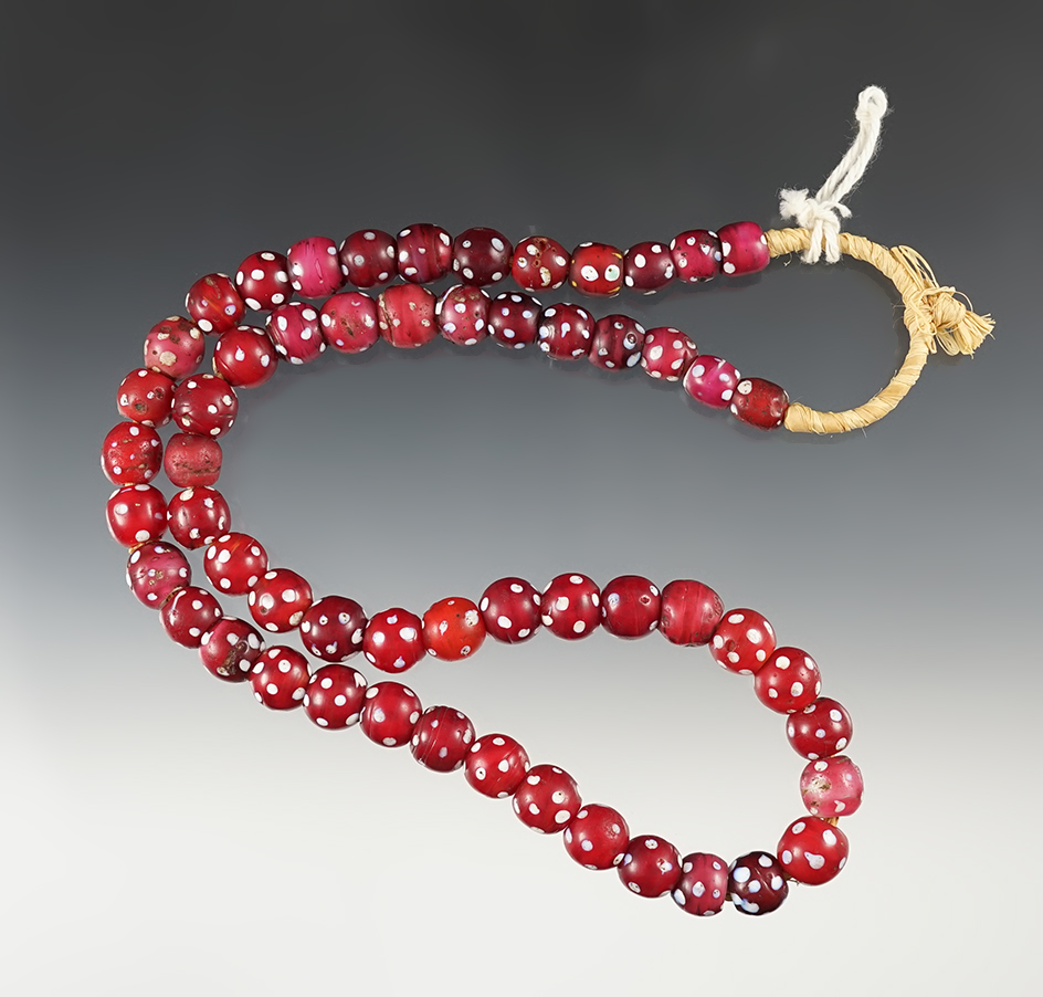24" long strand of red Skunk beads made in Venice and traded into Ethiopia.