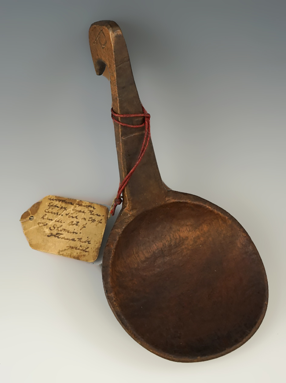 7 1/2" long effigy carved wooden spoon with a very old collector tag. Ottawa Tribe, Michigan.