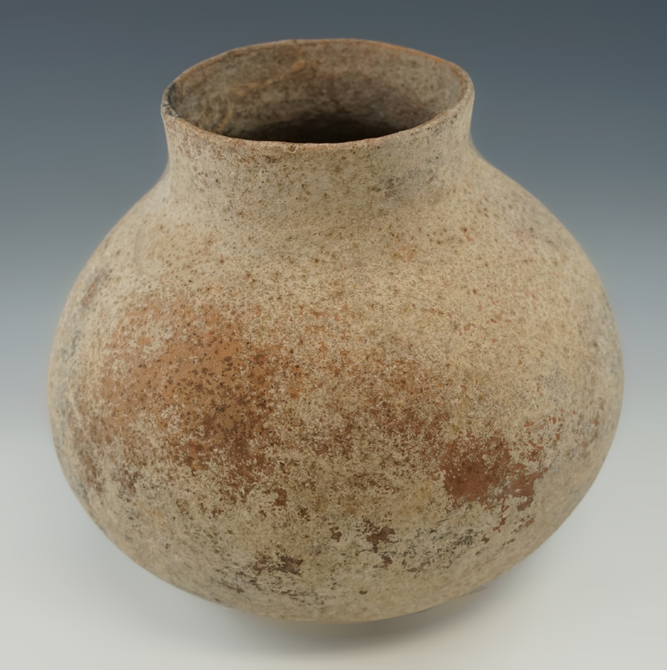 Large 7 1/4" pottery vessel with one small probe hole. Found in February, 1973 in Arizona.