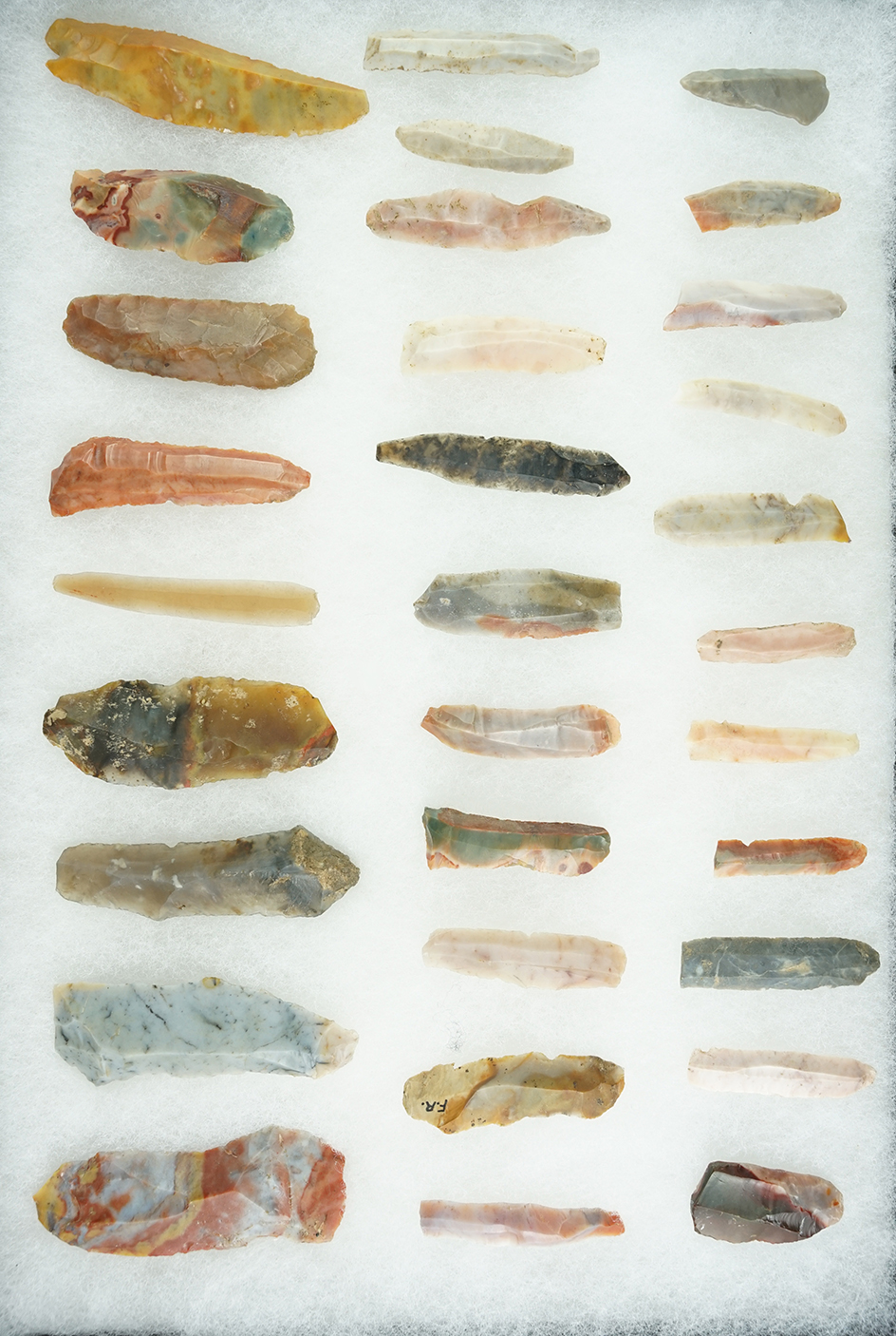 Beautiful frame of 31 colorful Flint Ridge Flint Hopewell Bladelets recovered in Licking Co., Ohio.