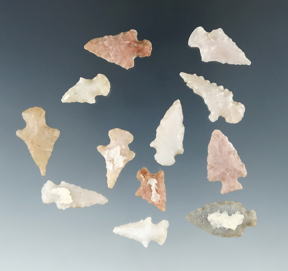 Set of 12 arrowheads made from nice material which were glued to a board, largest is 1".