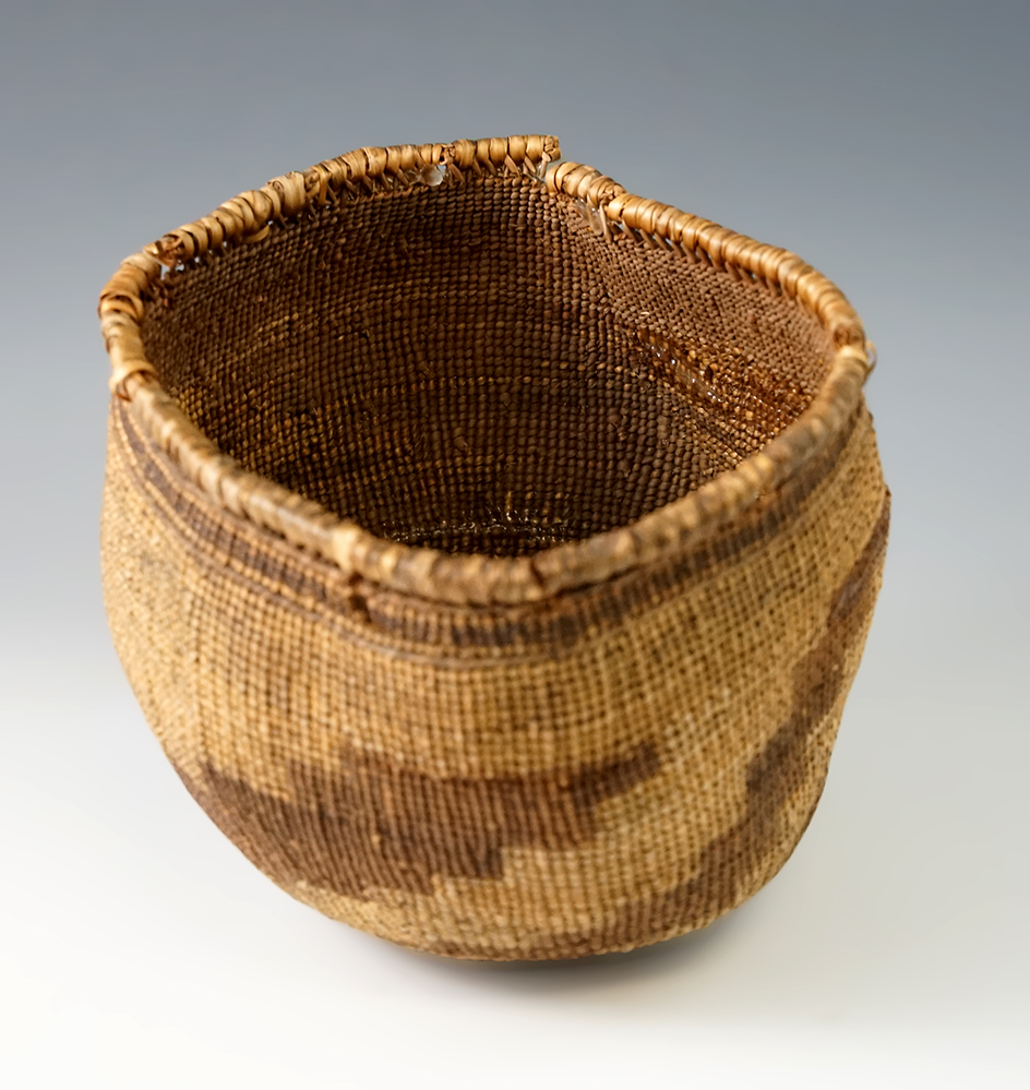 5" diameter wide by 4 5/8 tall tightly woven very old basket with some repair.