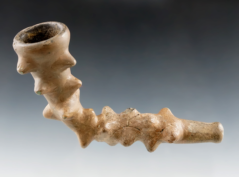 Very heavily restored 5" Thorn design Iroquois clay pipe found in New York.