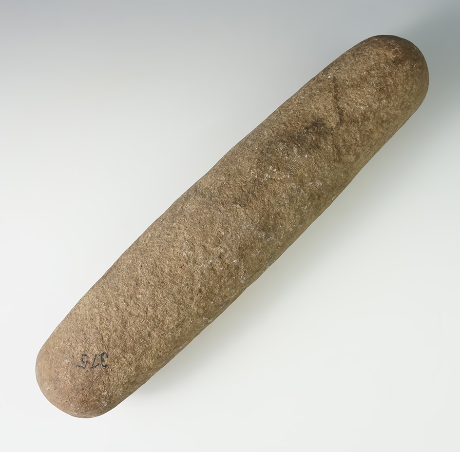 11 1/16" roller pestle with a ding found in New York.
