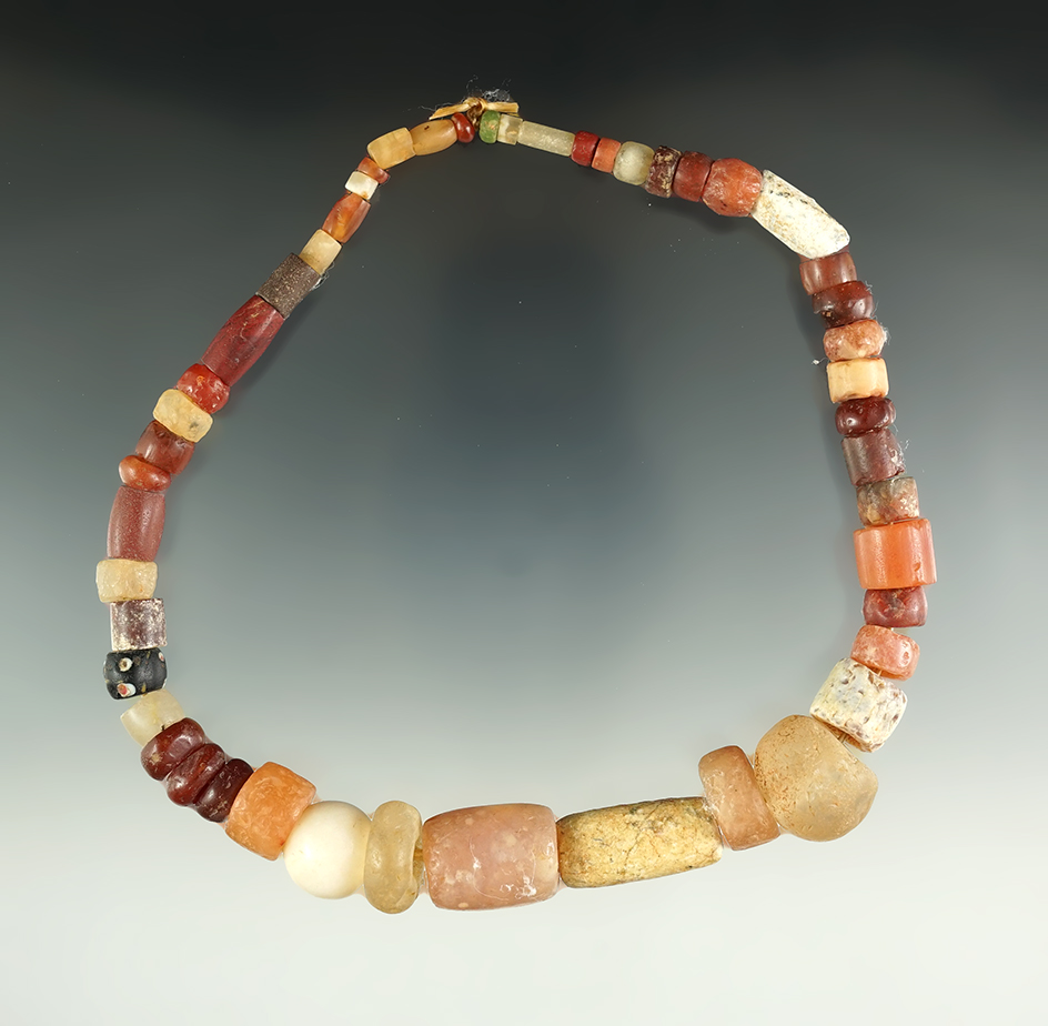 14" long strand of Neolithic African drilled stone beads that are very colorful!