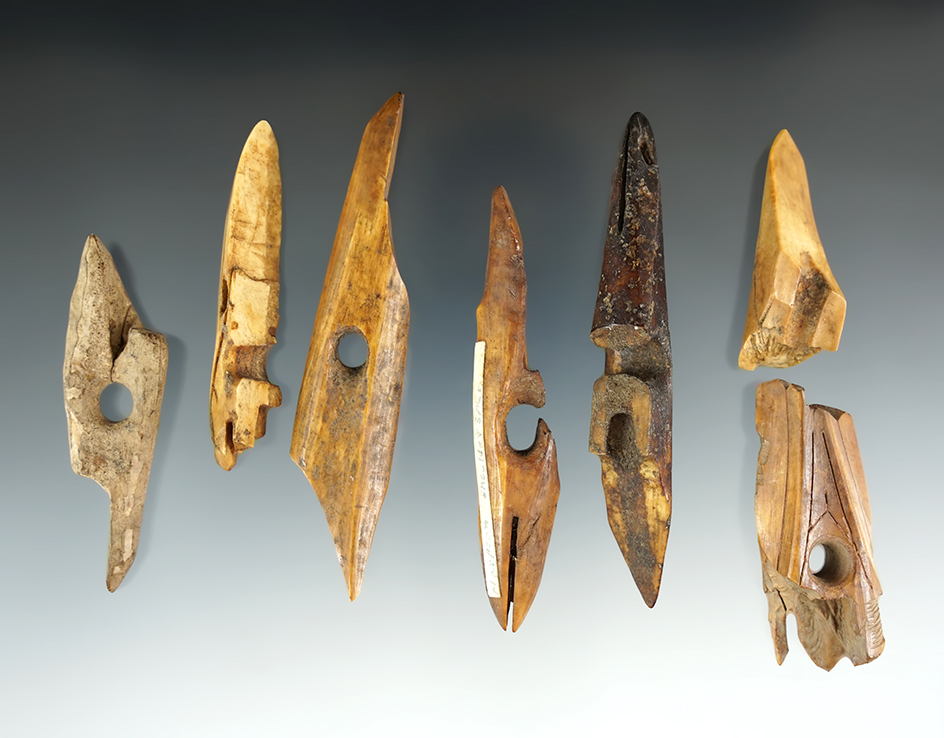 Group of Seven bone and ivory harpoon toggles, all have some degree of damage.  Alaska.