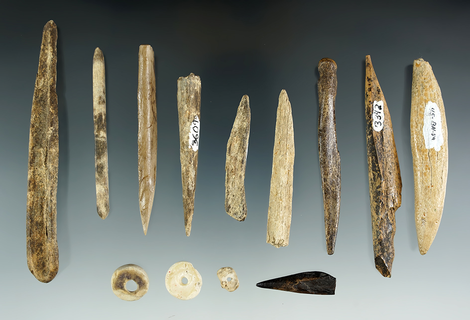Group of assorted bone tools and stone beads found in Umatilla, Oregon. Largest is 4 1/16".