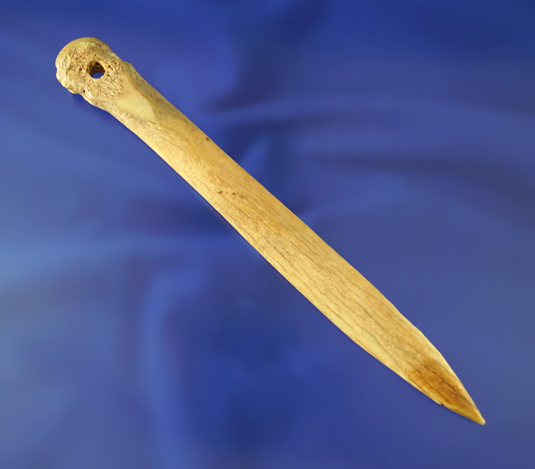 Heavily patinated 6 1/4" well styled Bone Awl with the suspension hole at one end. Fort Ancient.
