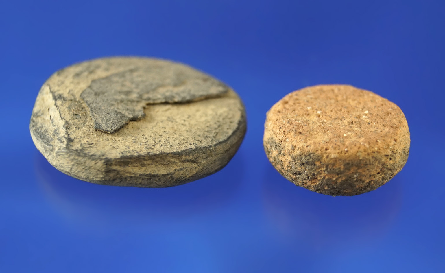 Pair of discs found in Ross Co., one is 1 1/4" stone, the other is 7/8" pottery.