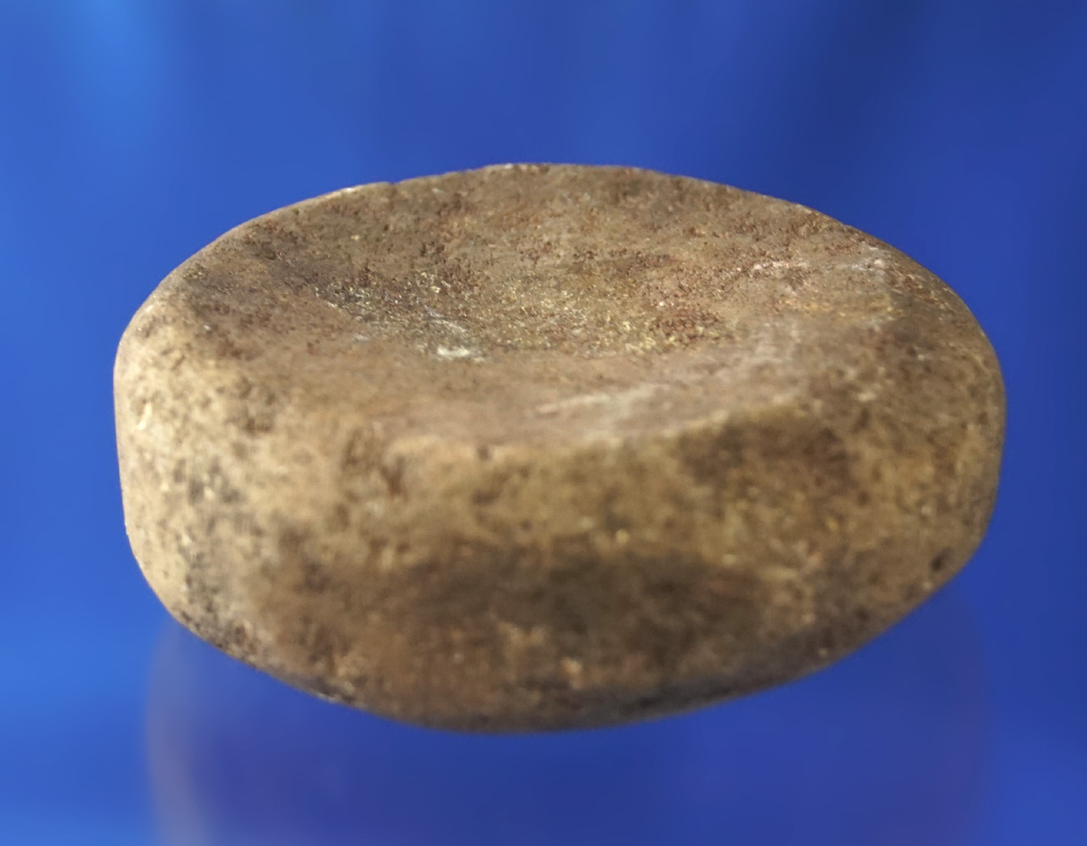 2 3/4" heavily patinated Discoidal that has been in many old collections. Nicely cupped both sides.