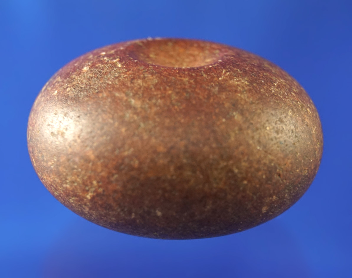 Highly polished 1 15/16" double dimpled red quartz Discoidal found in Illinois.