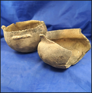Pair of pottery vessels found near the Tennessee River in Alabama in 1963 in unrestored condition.