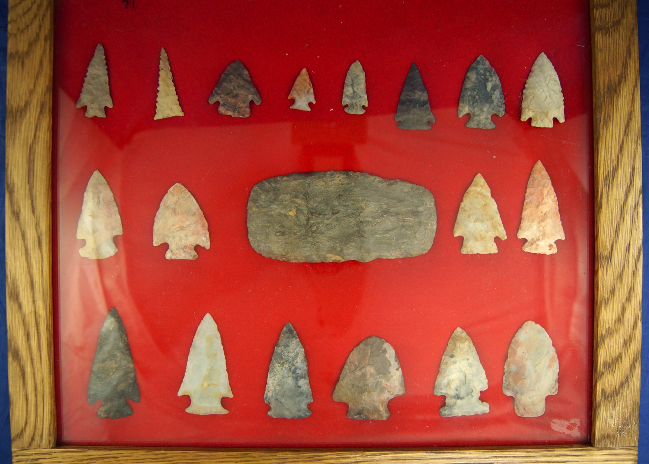 Framed group of 19 artifacts restored by Sam Speck, from the Sam Speck Collection.