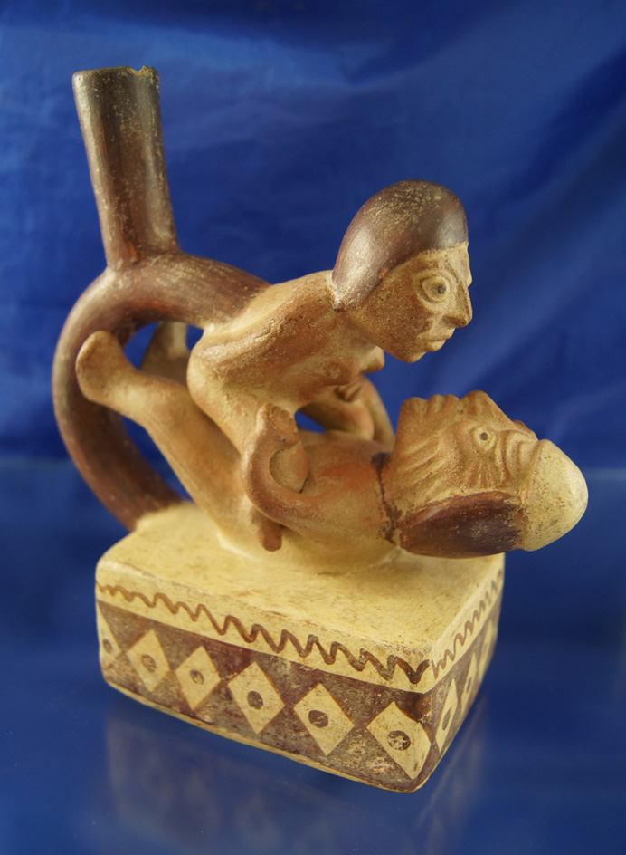 6 7/8" Moche culture erotic stirrup pottery vessel from Peru which is highly detailed.