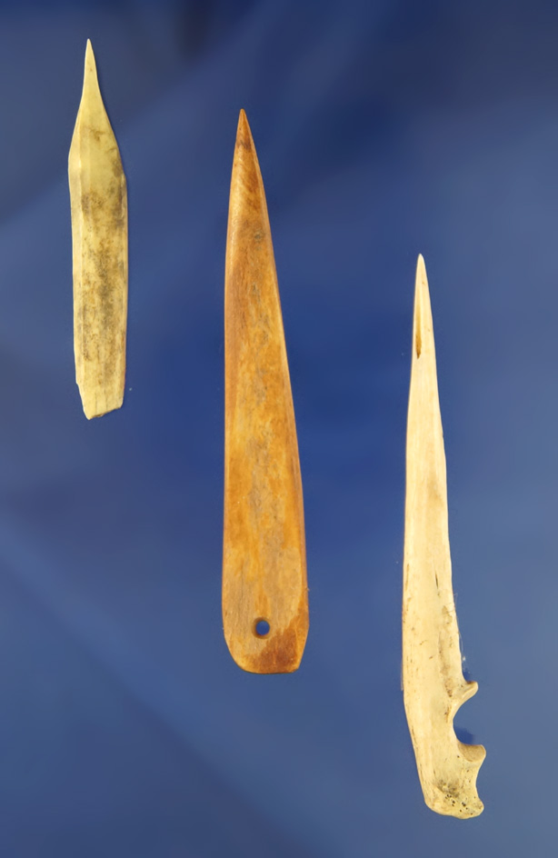 2 3/8" bone awl found at the Eagle Creek site, a 3 5/8" drilled bone awl. Kentucky - pictured.
