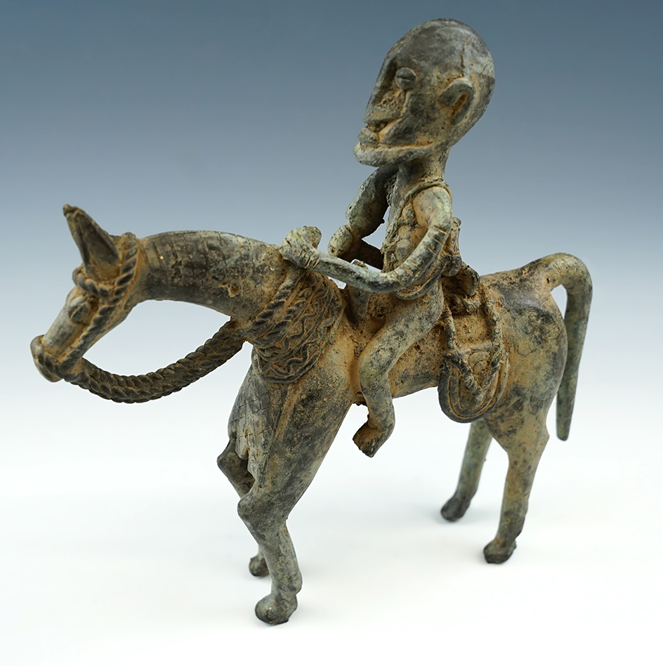 7 3/4" Asian bronze statue of a horse and warrior. Exact age and cultural affiliation uknown.