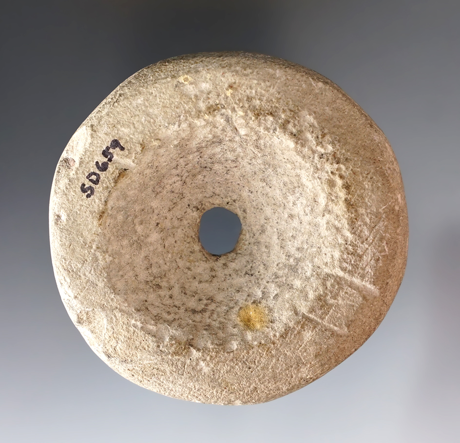 Patinated 2 1/2" Perforated Discoidal found in Mason Co., Kentucky.