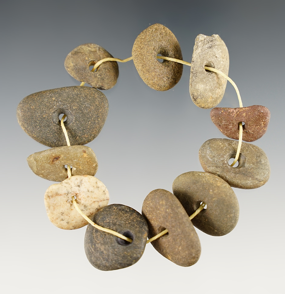 11 drilled stone/pebble beads - Mason Co., Kentucky by Charles Weatherford in the 1960's.