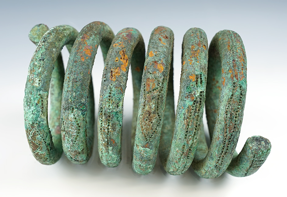 6" long heavy coiled money, circa early 1800's. Nigeria, Africa. Comes with a Bennett COA.