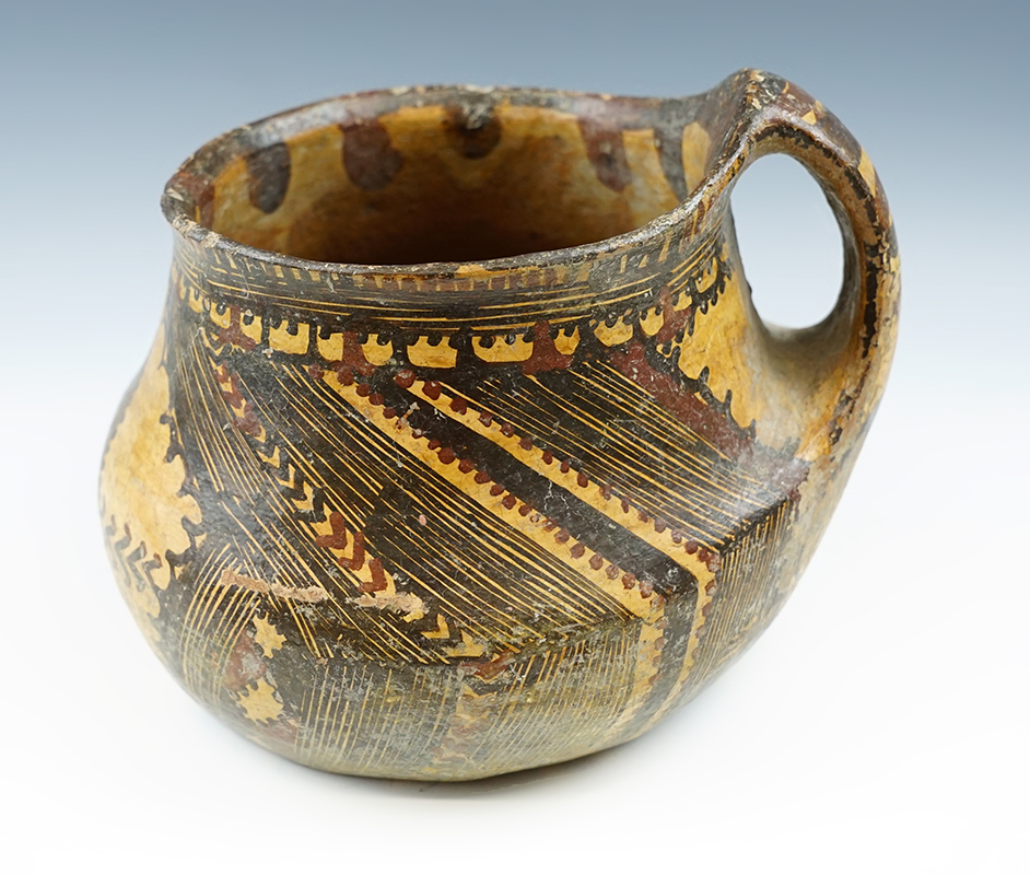 7 1/4" wide x 6" tall single handle Berber pottery vessel from Morocco.