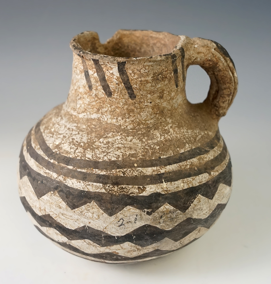 4 1/2" tall by 4 1/2" wide Anasazi black and white handled pitcher found in New Mexico.