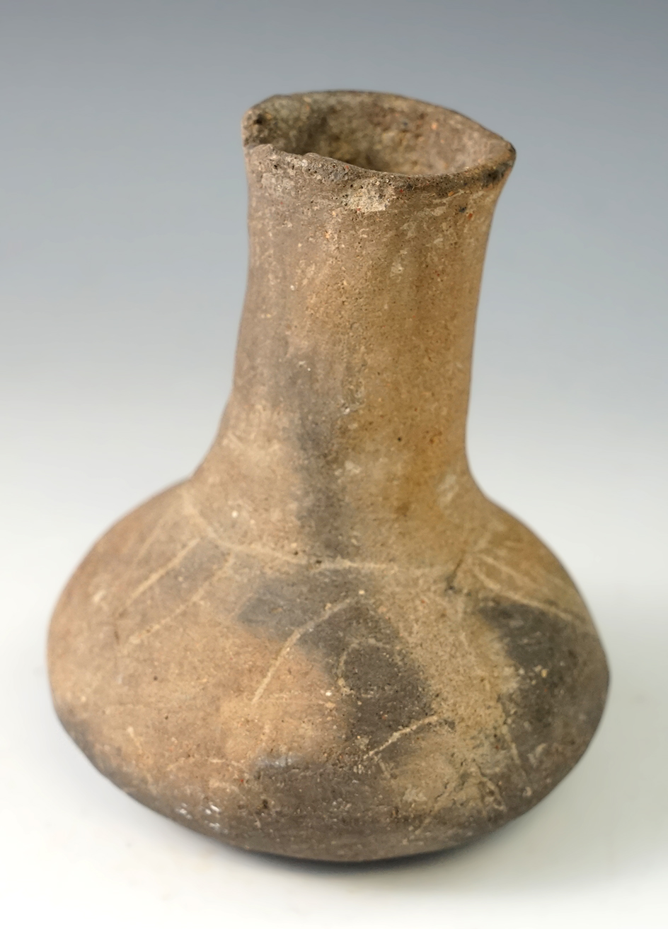 3 3/4" tall miniature engraved Caddo bottle in solid condition - Hempstead Co., Arkansas.