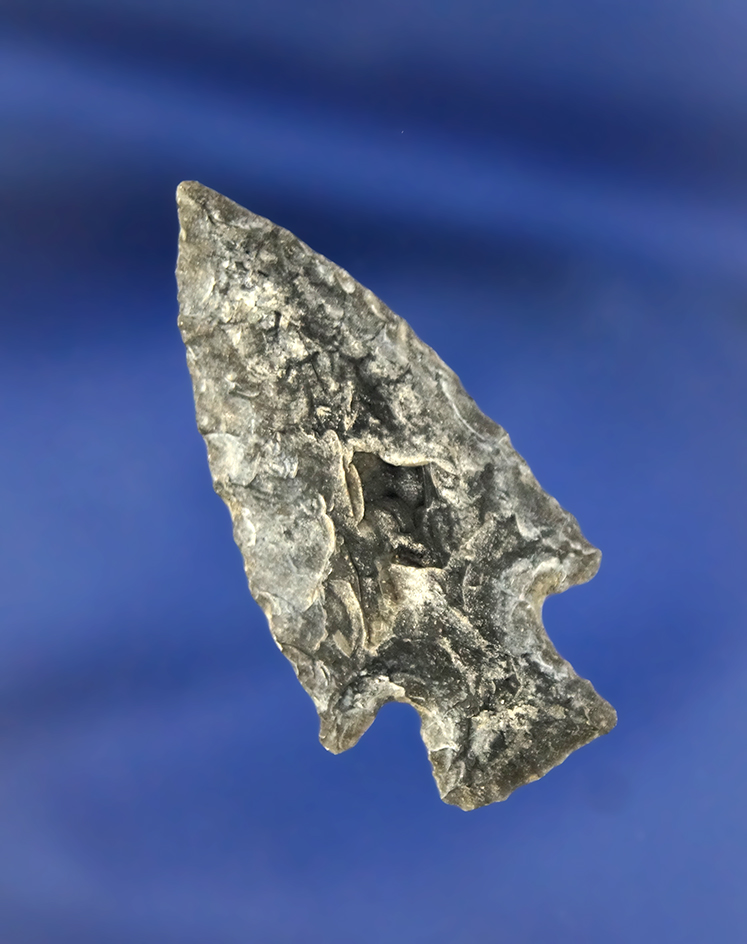 1 5/8" Stemmed Point that is heavily patinated, found in Oregon.