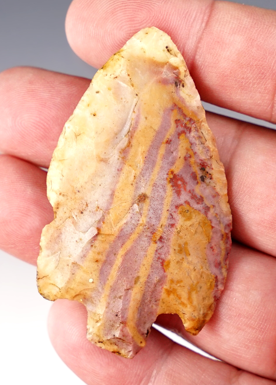 2 1/2" Adena made of very colorful exotic orange and purple striped flint. Found in Illinois.