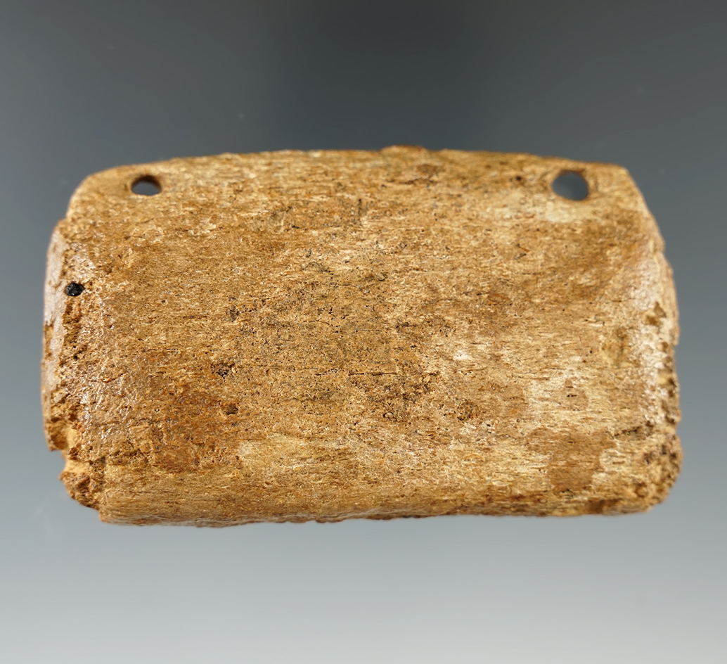 3 5/16" Inuit drilled fishing weight made from whale bone found in Alaska.