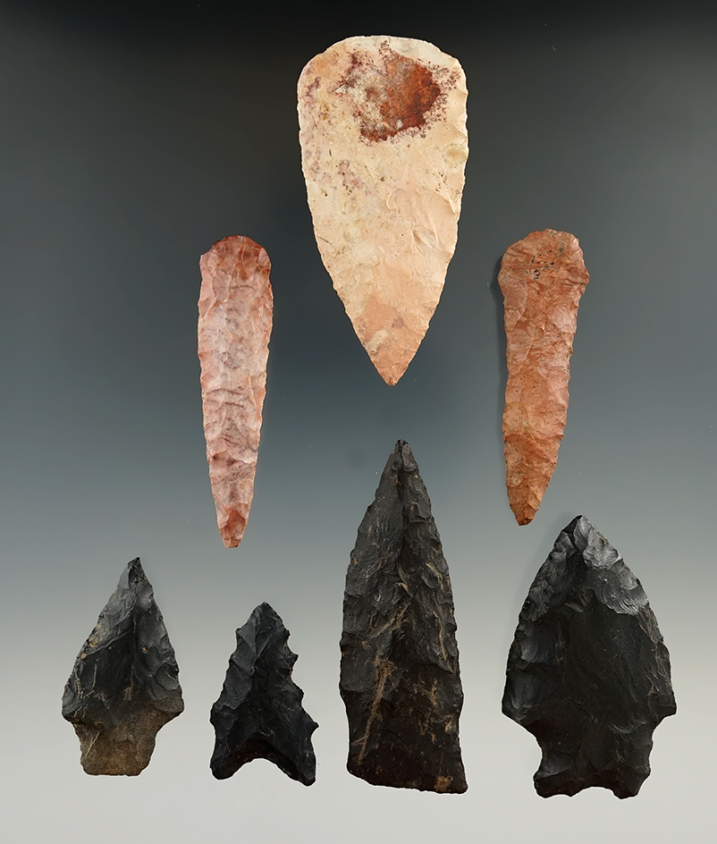 Group of seven Flint artifacts.One blade which has some modern retouch to base. Largest is 2 9/16".