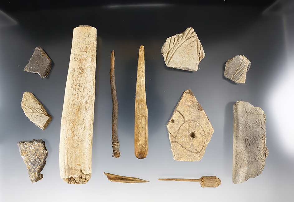 Set of bone tools and pottery pieces found at a cave site in Kentucky. The largest is 5 1/4".