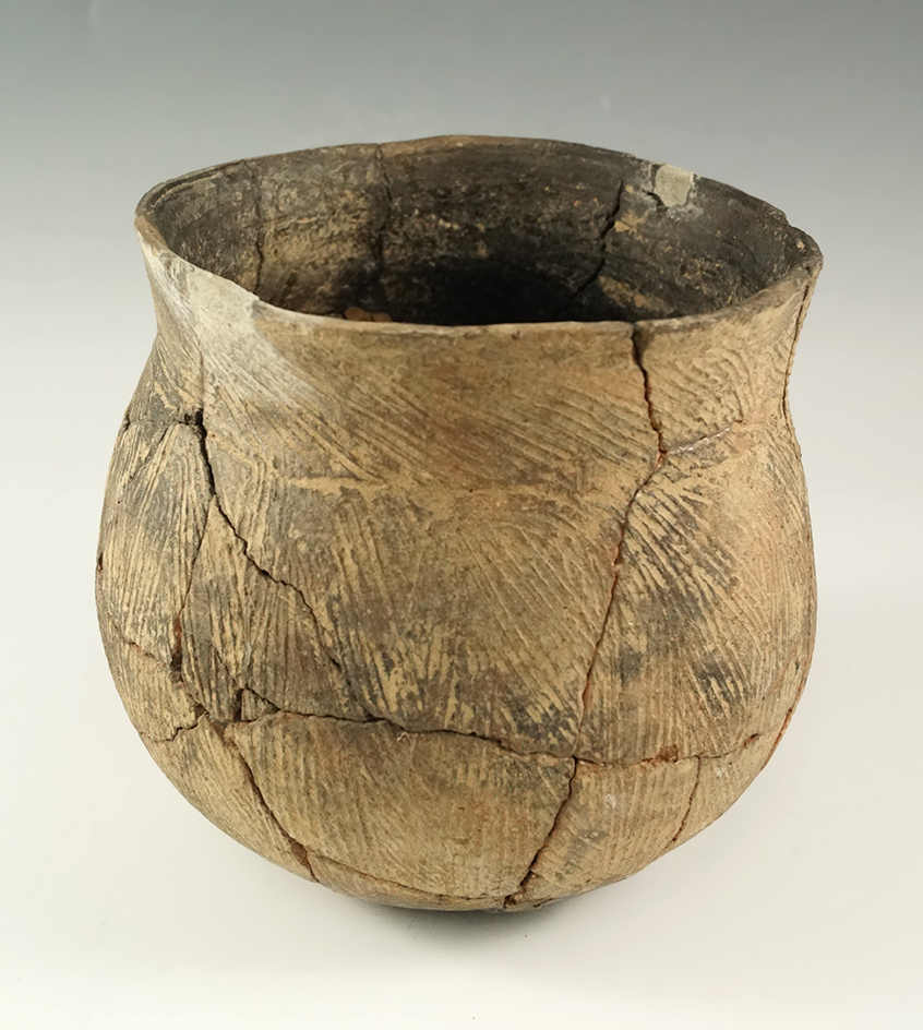 5 1/4" tall by 4 7/8" wide pottery vessel, peace brushed-incised, found at the Resch site April 14,
