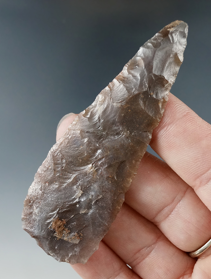 3 3/16" nicely flaked knife made from semi translucent agate that is broken and glued at the mid sec