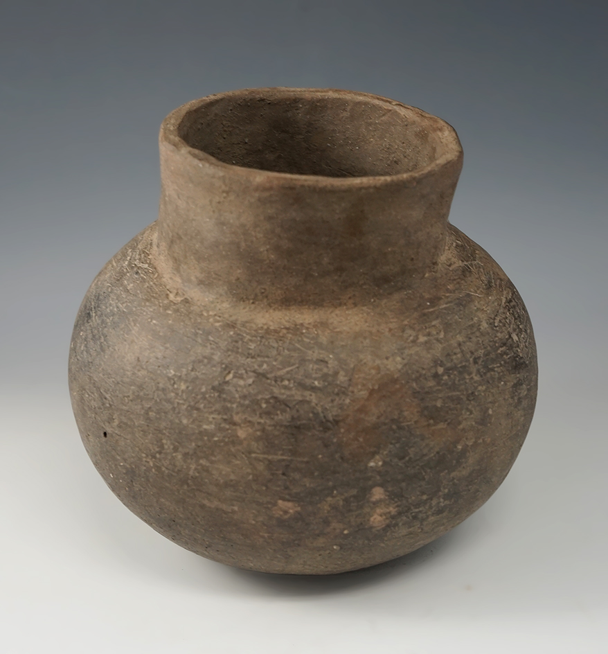 5 3/4" Tall x 6 1/2" Wide Short Neck Water Bottle with a restored neck area. Found in Arkansas.