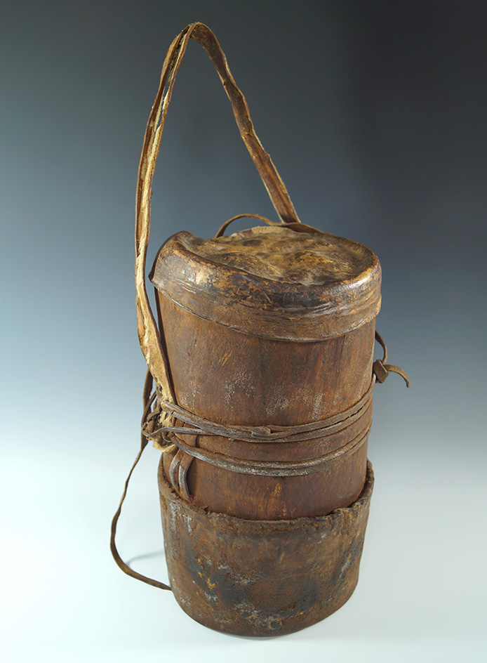 Very unique 10 1/4" tall very old carved wood and leather container in great condition