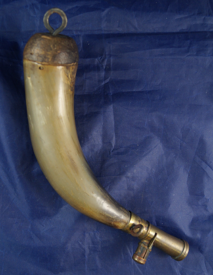 Powder horn with very unique brass charger from the 1800s.
