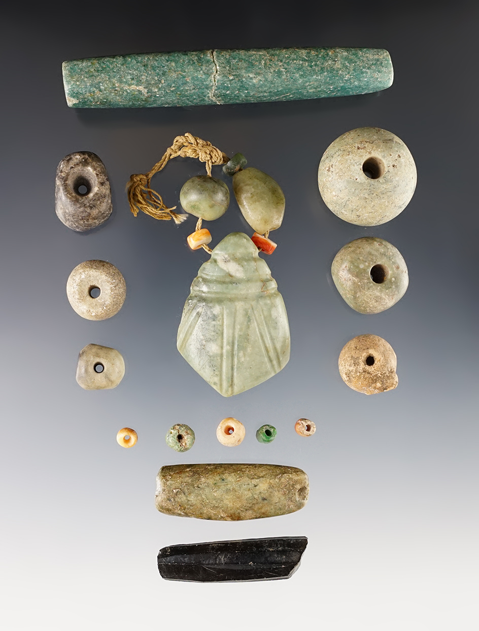  Group of assorted Pre-Columbian artifacts including beads and pendant. Largest is 3 3/4".