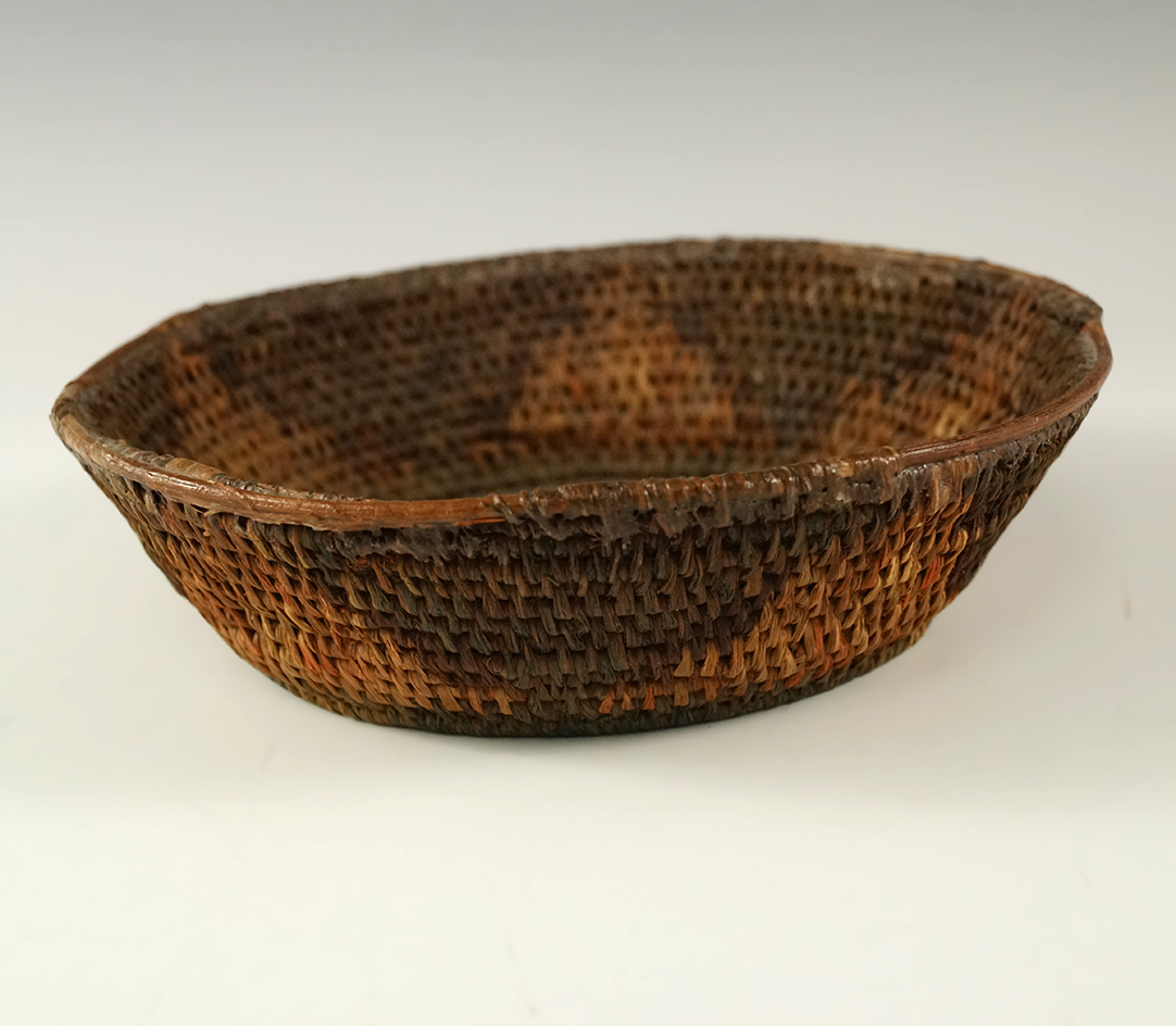 Old, colorful and nicely woven 5 1/2" wide basket.