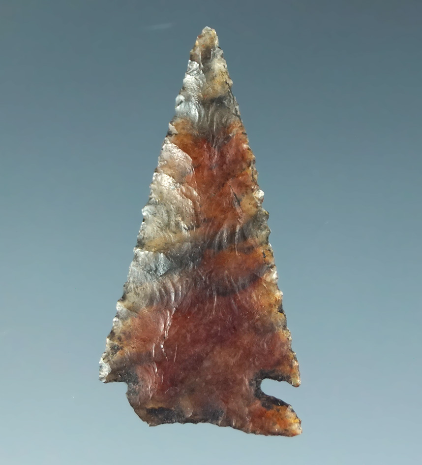 1" cornernotch that is exceptionally well flaked made from high grade multi-colored agate. CA.