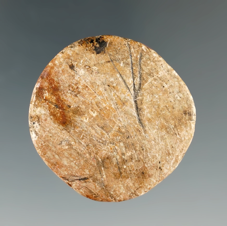 Unique etched Catlinite Disc or game piece found by H. Olson in Brookings Co., South Dakota.