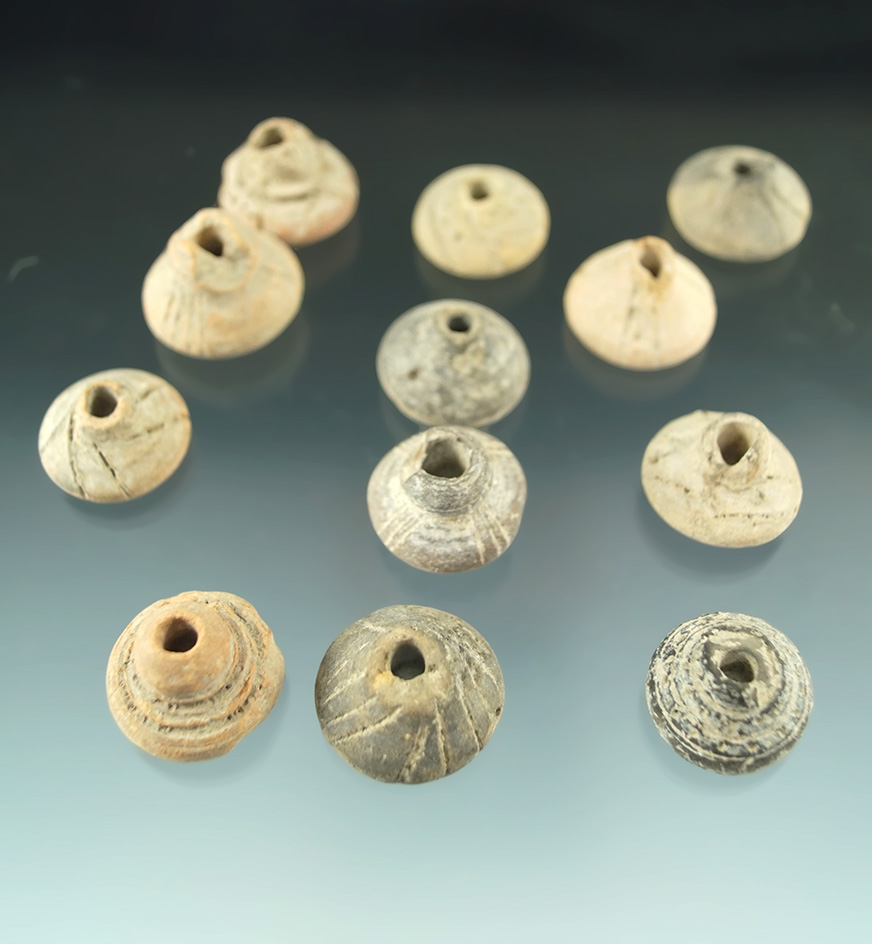 Set of 12 Aztec spindle worlds made from fired clay found in central Mexico.