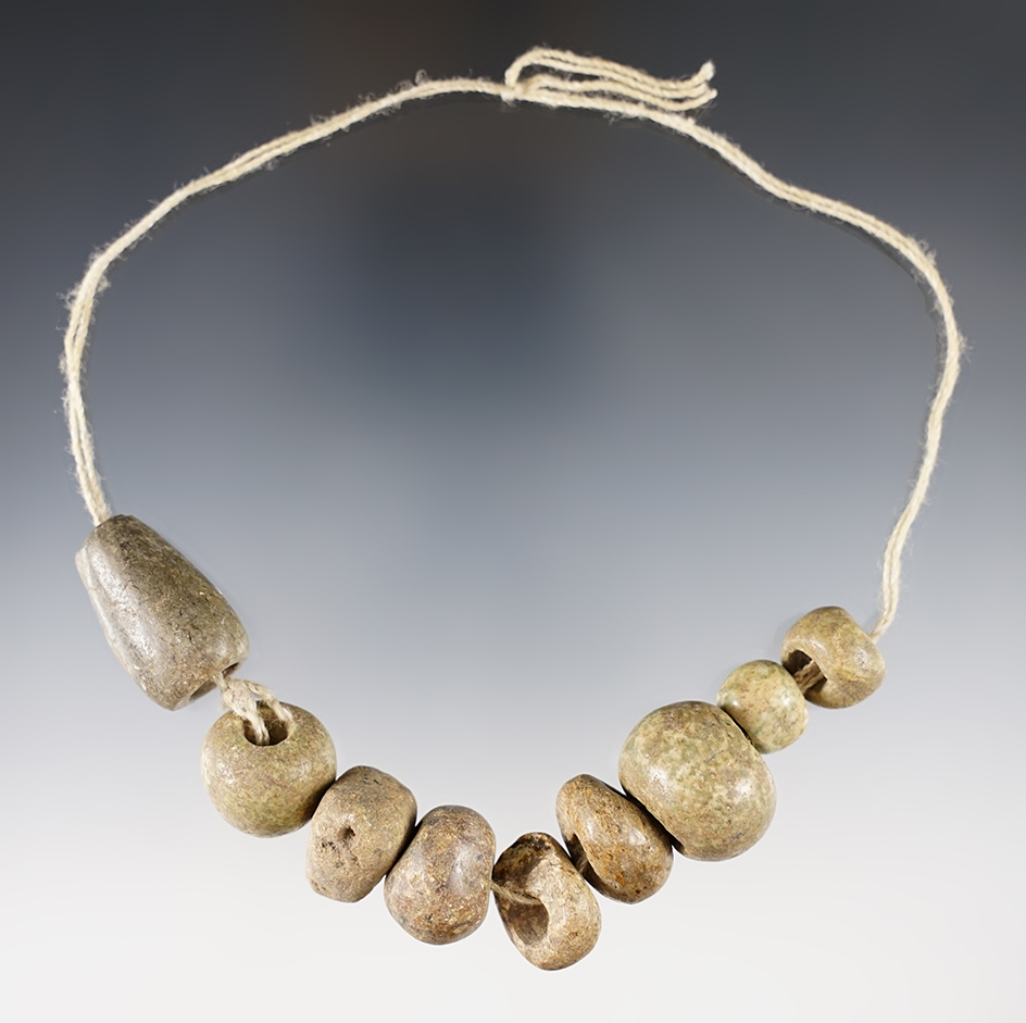 Strand of nine drilled stone Mescala beads found in Guerrero, Mexico. Largest is 1 1/8".