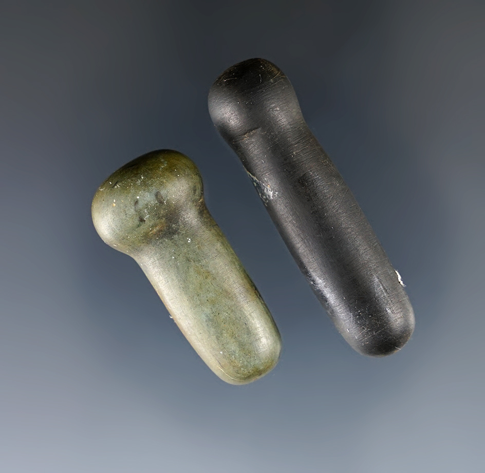 Pair of polished stone facial ornaments, largest is 1 11/16".